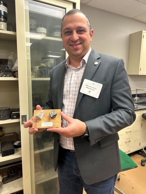 Dr. Elwardany holding specimens
