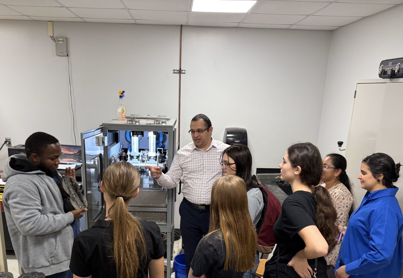 Dr. Elwardany in his lab with students