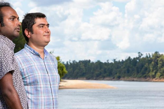 Dr. Ebrahem Ahmadisharaf and PhD student photographed on the bank of the Apalachicola River