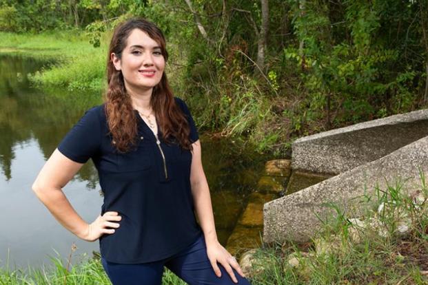 Dr. Nasrin Alamdari photographed on a river bank