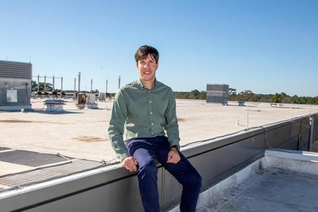 Pedro Fernández-Cabán photographed on the roof of a building on campus