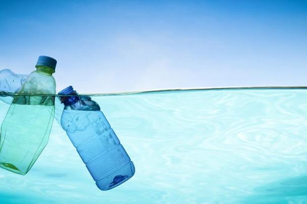 Plastic bottles floating in water