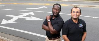Dr. Eren Ozguven and PhD student Richard Antwi photographed together on highway
